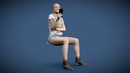 Woman sitting using cellphone