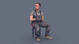 Foreman in Overalls Sitting