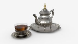 Silver Teapot and Cup with Tea