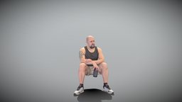 Athletic man sitting with water bottle 398