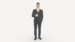 man in dark gray quads suit hand on jacket 1085